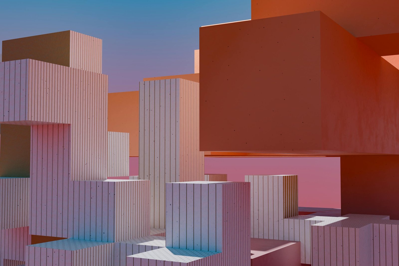 Photo by Steve Johnson Modern abstract architecture with geometric block shapes and vibrant sunset hues.